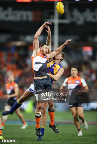 Shane Mumford of the Giants is challenged by Nathan Vardy of the Eagles during the round 22 AFL match between the Greater Western Sydney Giants and...