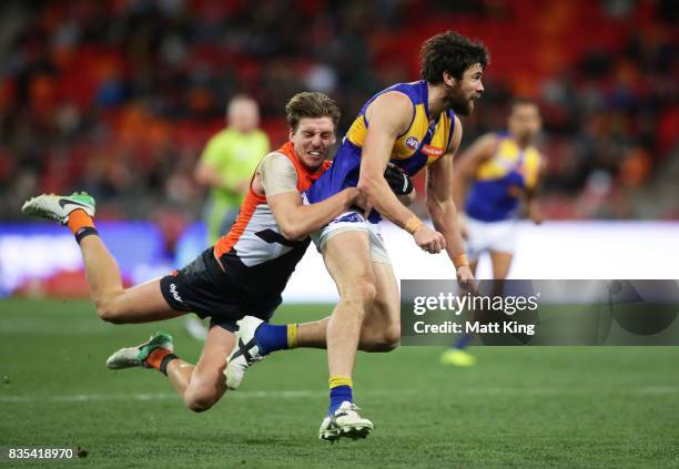 Josh Kennedy of the Eagles is tackled by Aidan Corr of the Giants during the round 22 AFL match between the Greater Western Sydney Giants and the...