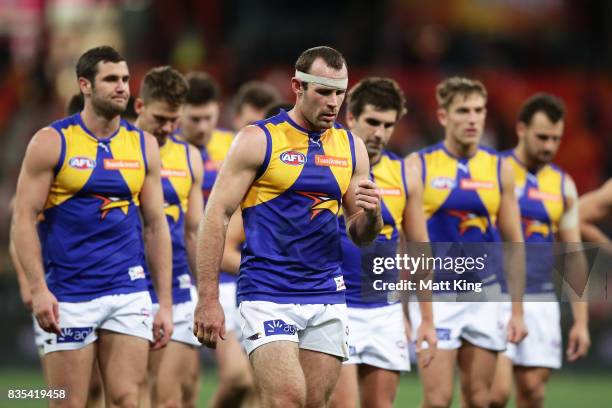 Shannon Hurn captain of the Eagles and team mates look dejected after the round 22 AFL match between the Greater Western Sydney Giants and the West...