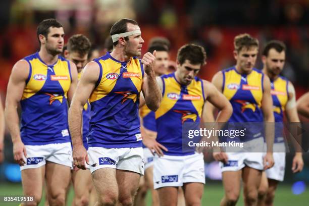 Shannon Hurn captain of the Eagles and team mates look dejected after the round 22 AFL match between the Greater Western Sydney Giants and the West...