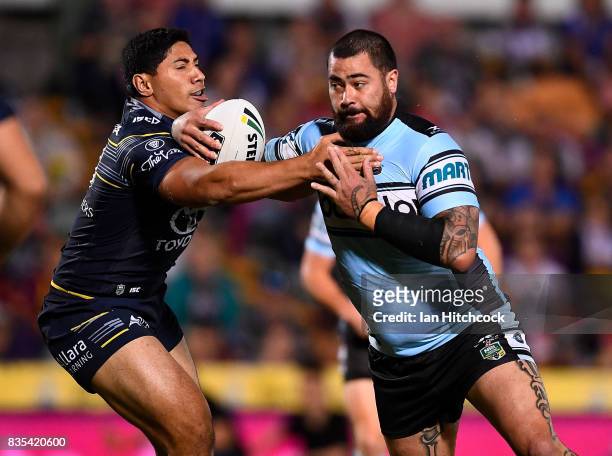 Andrew Fifita of the Sharks is tackled by Jason Taumalolo of the Cowboys during the round 24 NRL match between the North Queensland Cowboys and the...