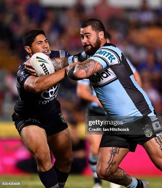 Andrew Fifita of the Sharks is tackled by Jason Taumalolo of the Cowboys during the round 24 NRL match between the North Queensland Cowboys and the...