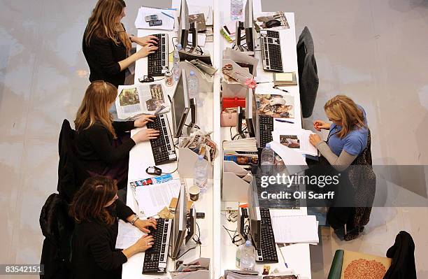 Production staff on the weekly fashion magazine, Grazia edit the magazine in a temporary office inside the Westfield shopping centre on November 3,...