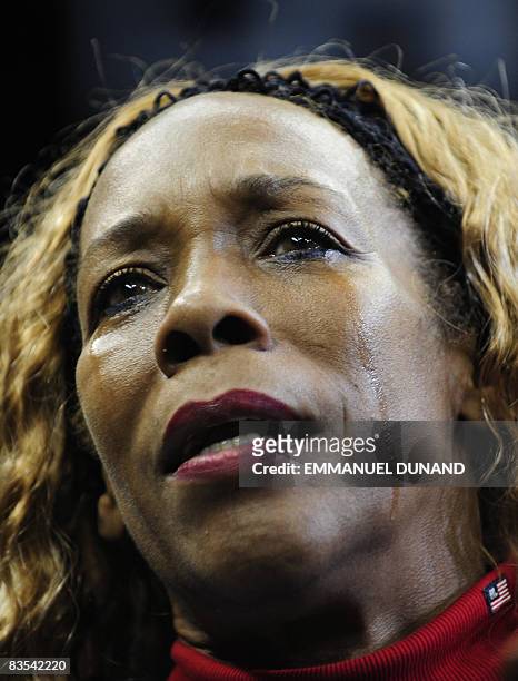 Supporter of US Democratic presidential candidate Illinois Senator Barack Obama sheds tears during Obama's speech at a rally in Jacksonville,...