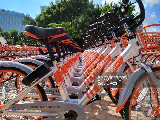 The customized shared bicycles with slogans that eulogize China are seen lined up on the street at Futian District on August 19, 2017 in Shenzhen,...