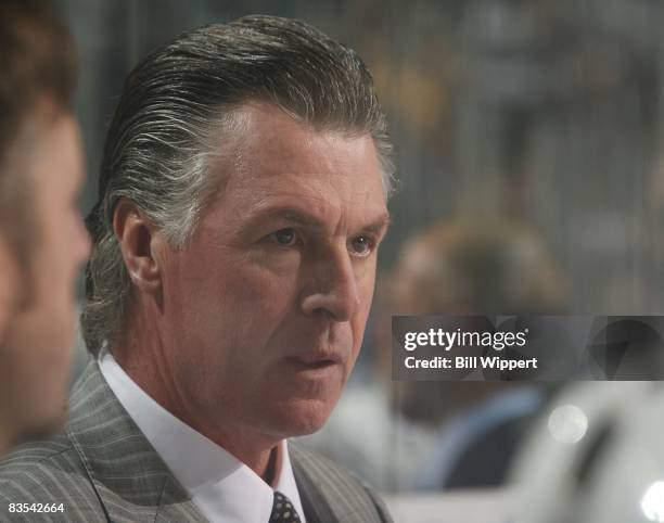 Head coach Barry Melrose of the Tampa Bay Lightning watches from behind the bench in the game against the Buffalo Sabres on October 30, 2008 at HSBC...