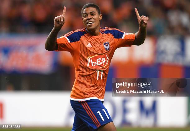 Douglas Tanque of Albirex Niigata celebrates scoring the opening goal during the J.League J1 match between Albirex Niigata and Vegalta Sendai at...