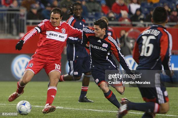 October 30: Cuauhtemoc Blanco of the Chicago Fire and Jay Heaps of the New England Revolution battle for the ball during the game played at Gillette...