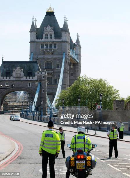 Police keep the road on London's Tower Bridge closed after an elevator accident in the north tower of the structure, which left six people injured.