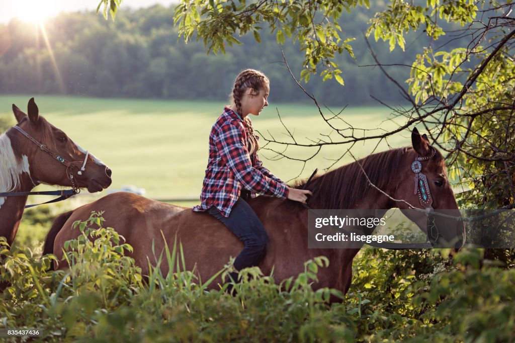 Teenager riding horse