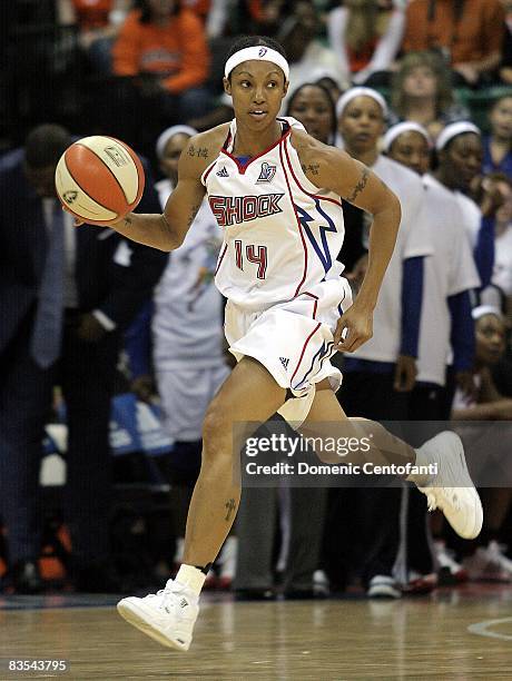 Deanna Nolan of the Detroit Shock brings the ball up court during the game against the San Antonio Silver Stars in Game Three of the WNBA Finals on...