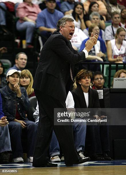 Head coach Dan Hughes of the San Antonio Silver Stars claps on the sideline during the game against the Detroit Shock in Game Three of the WNBA...
