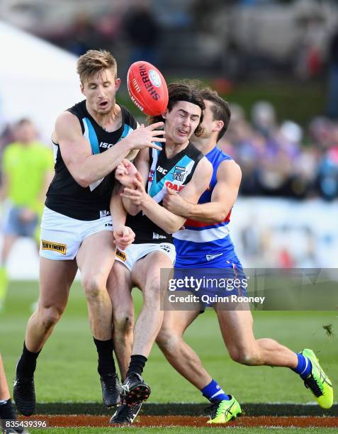 Hamish Hartlett and Darcy Byrne-Jones of the Power run into each other during the round 22 AFL match between the Western Bulldogs and the Port...