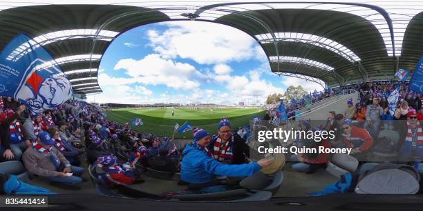 Fans in the new grandstand at Mars Stadium cheer as the Bulldogs run out ont the ground during the round 22 AFL match between the Western Bulldogs...