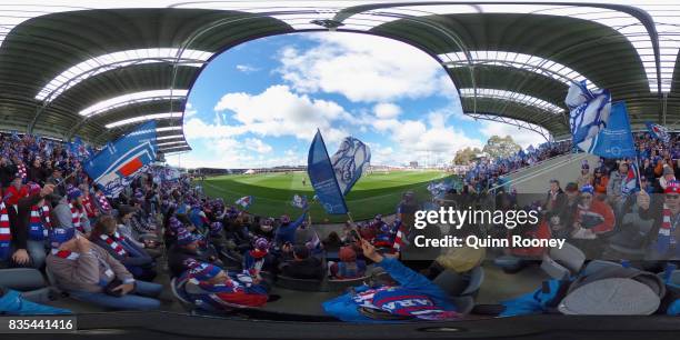 Fans in the new grandstand at Mars Stadium cheer as the Bulldogs run out ont the ground during the round 22 AFL match between the Western Bulldogs...