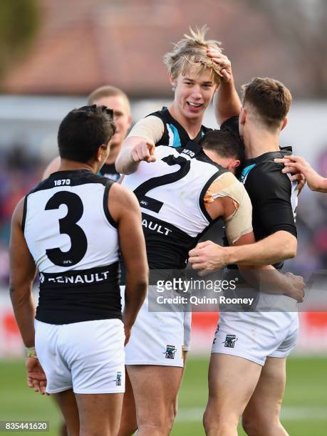 Todd Marshall of the Power celebrates a goal with team mates during the round 22 AFL match between the Western Bulldogs and the Port Adelaide Power...