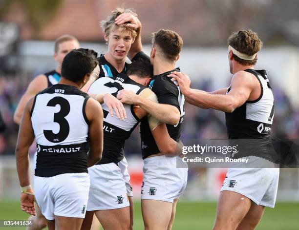 Todd Marshall of the Power celebrates a goal with team mates during the round 22 AFL match between the Western Bulldogs and the Port Adelaide Power...