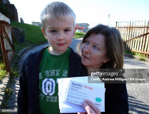 Five year old Joshua McDonald with his grandmother Alice Curran with their Tamiflu after leaving Ladybird Nursery in Greenock which was closed today...