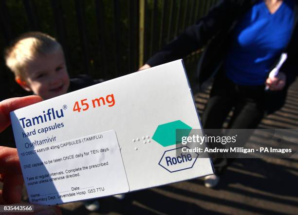 Five year old Joshua McDonald with his grandmother Alice Curran with their Tamiflu after leaving Ladybird Nursery in Greenock which was closed today...