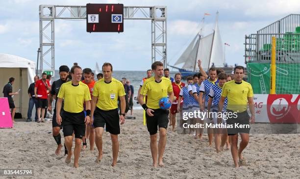 Referees and players enter the pitch on day 1 of the 2017 German Beach Soccer Championship on August 19, 2017 in Warnemunde, Germany.