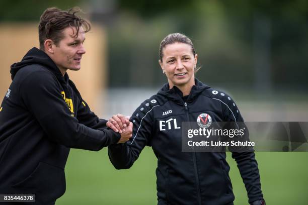 Head Coach Sebastian Geppert and Head Coach Inka Grings shake hands after the B Juniors Bundesliga match between Borussia Dortmund and FC Viktoria...