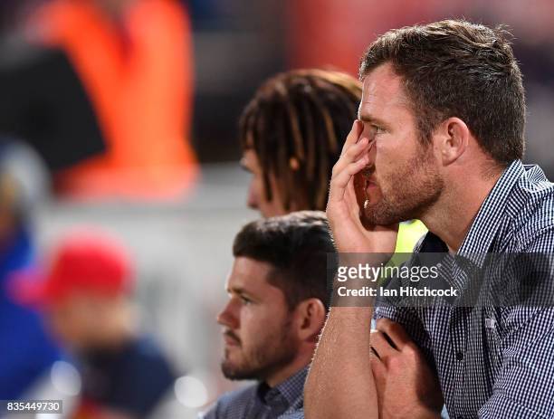 Gavin Cooper of the Cowboys looks on from the bench during the round 24 NRL match between the North Queensland Cowboys and the Cronulla Sharks at...