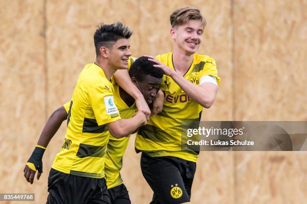 Lucas Klantzos , Youssoufa Moukoko and Max Fleer of Dortmund celebrate the goal during the B Juniors Bundesliga match between Borussia Dortmund and...