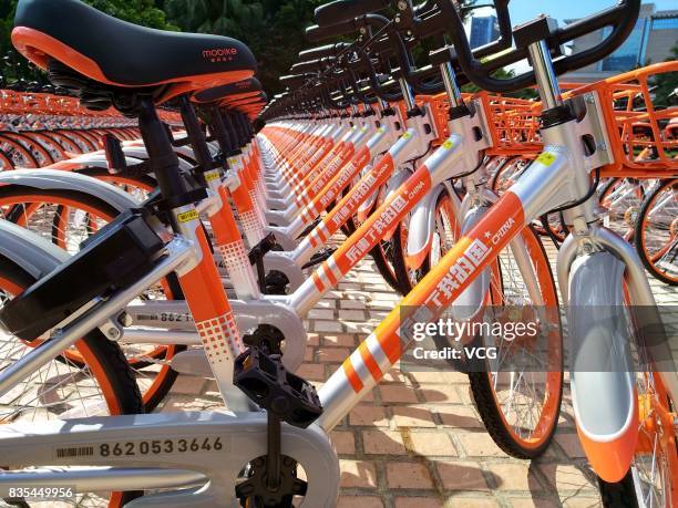 The customized shared bicycles with slogans that eulogize China are seen lined up on the street at Futian District on August 19, 2017 in Shenzhen,...