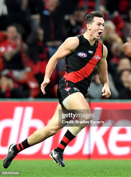Conor McKenna of the Bombers celebrates after kicking a goal during the round 22 AFL match between the Gold Coast Suns and the Essendon Bombers at...