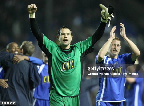 Millwall goalkeeper David Forde and teammate David Martin celebrate at the final whistle during the Coca-Cola Football League One Play Off Semi Final...