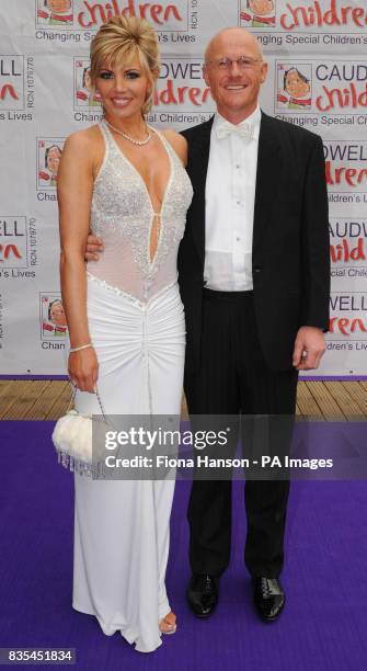 Caudwell Children event sponsor, John Caudwell and partner Claire Johnson Caudwell, arrive for the Butterfly Ball in Battersea Park, London. The...