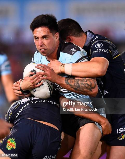 Gerard Beale of the Sharks is tackled during the round 24 NRL match between the North Queensland Cowboys and the Cronulla Sharks at 1300SMILES...