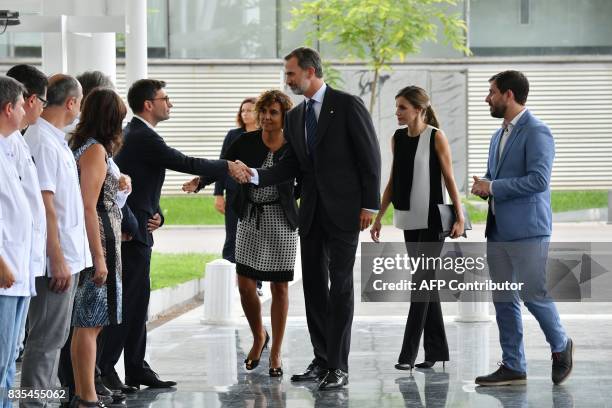 Spain's King Felipe VI and Queen Letizia meet medical staff of the Hospital del Mar in Barcelona, as they arrive to visit victims of the Barcelona...