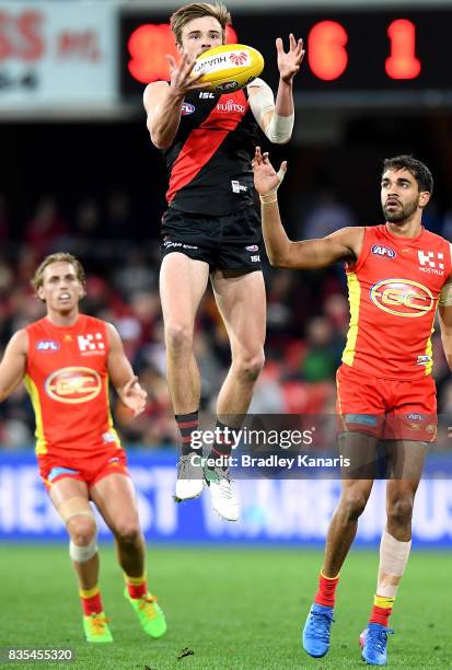 Martin Gleeson of the Bombers takes a mark during the round 22 AFL match between the Gold Coast Suns and the Essendon Bombers at Metricon Stadium on...