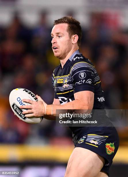 Michael Morgan of the Cowboys runs the ball during the round 24 NRL match between the North Queensland Cowboys and the Cronulla Sharks at 1300SMILES...