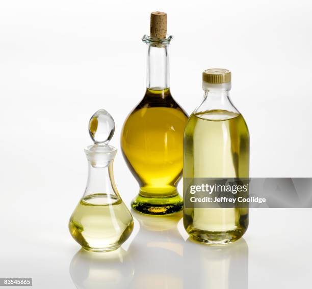 cooking oils in bottles still life - oil bottle stock pictures, royalty-free photos & images