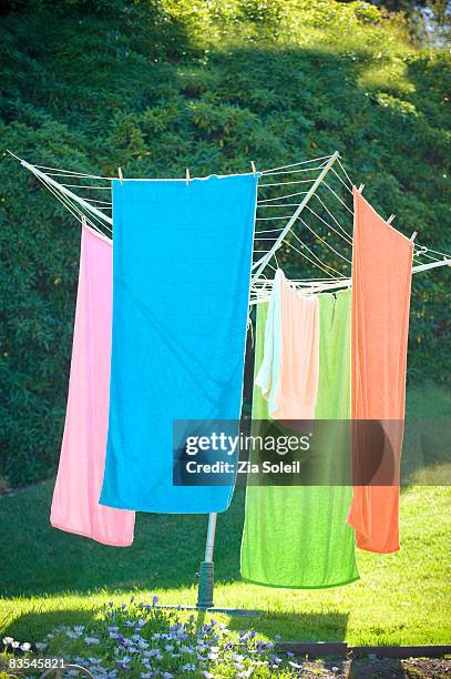 backyard clothes line full of towels - clothes peg stock pictures, royalty-free photos & images
