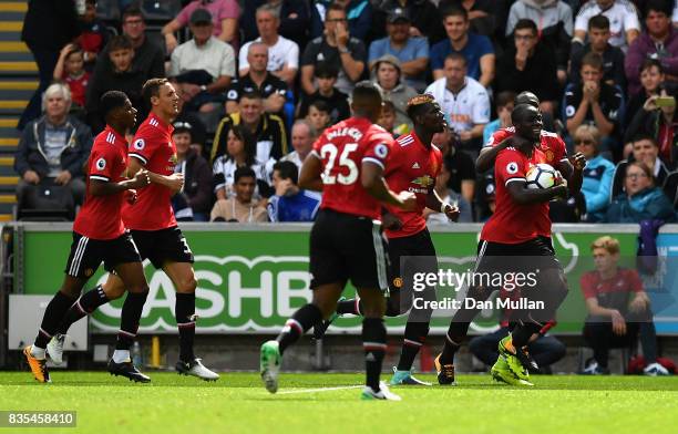 Eric Bailly of Manchester United celebrates scoring his sides first goal with his Manchester Untited team mates during the Premier League match...