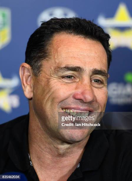 Sharks coach Shane Flanagan smiles in the post match media conference at the end of during the round 24 NRL match between the North Queensland...