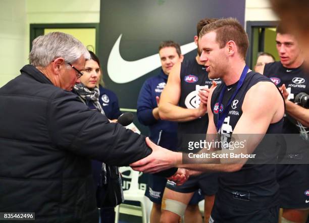 Sam Docherty of the Blues is presented with the David Parkin medal during the round 22 AFL match between the Carlton Blues and the Hawthorn Hawks at...