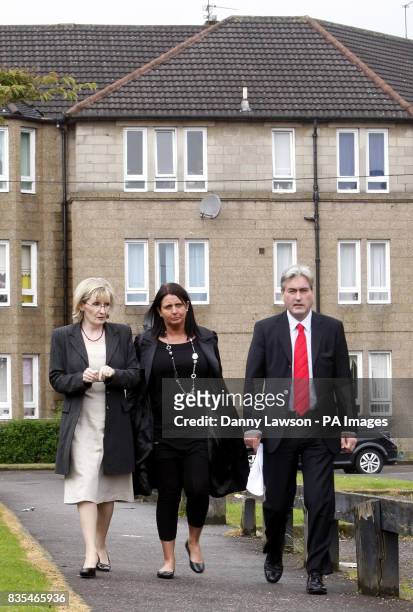 Margaret Curran , Scottish Labour leader Iain Gray and Christine Halley, mother of Stuart Baillie who died after being stabbed in 2007, during the...