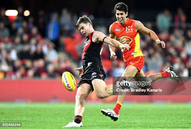 Craig Bird of the Bombers in action during the round 22 AFL match between the Gold Coast Suns and the Essendon Bombers at Metricon Stadium on August...