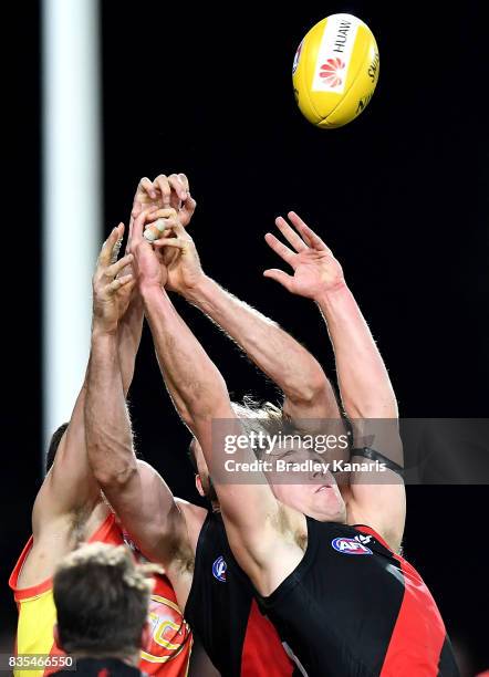 Joshua Begley of the Bombers competes for the ball during the round 22 AFL match between the Gold Coast Suns and the Essendon Bombers at Metricon...