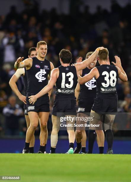 The Blues celebrate at the final siren and winning the round 22 AFL match between the Carlton Blues and the Hawthorn Hawks at Etihad Stadium on...