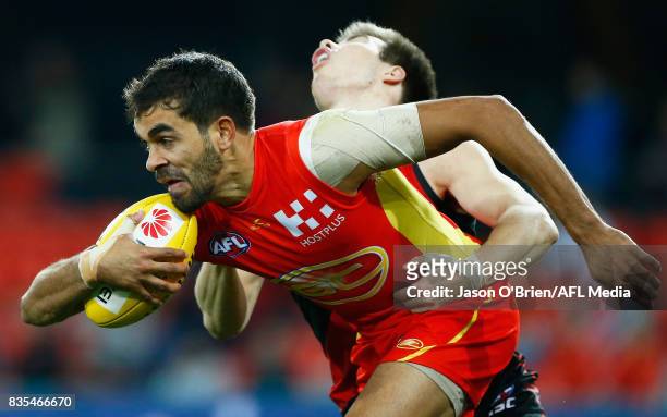 Jack Martin of the suns in action during the round 22 AFL match between the Gold Coast Suns and the Essendon Bombers at Metricon Stadium on August...