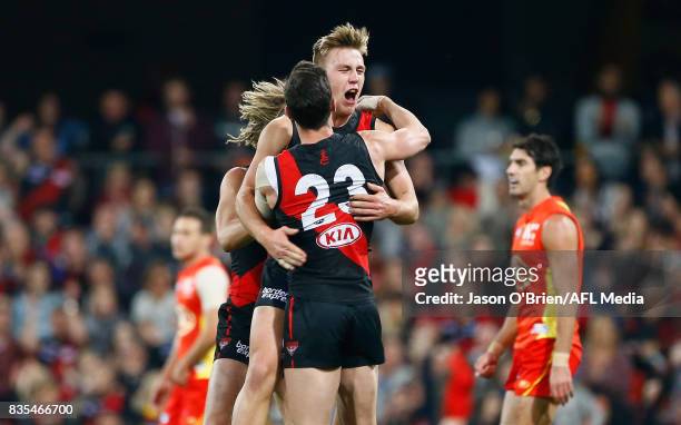 Joshua Begley of the Bombers celebrates kicking a goal during the round 22 AFL match between the Gold Coast Suns and the Essendon Bombers at Metricon...