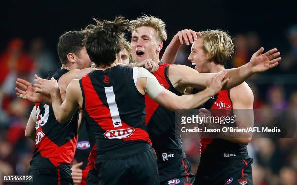 Joshua Begley of the Bombers celebrates kicking a goal during the round 22 AFL match between the Gold Coast Suns and the Essendon Bombers at Metricon...