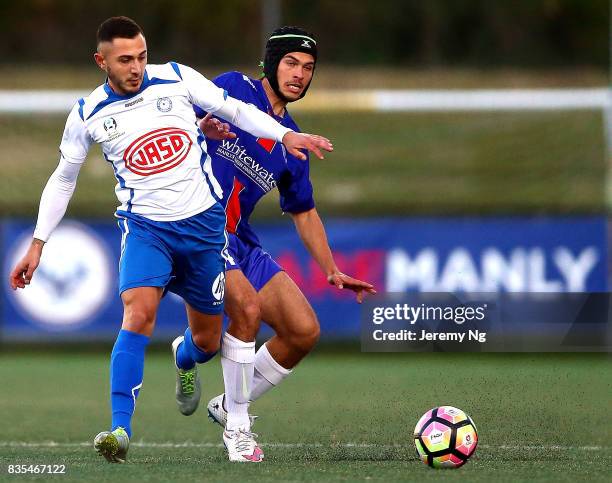 Nikolas Tsattalios of Sydney Olympic and Dejan Pandurevic of Manly United challenge for the ball during the NSW NPL 1 Elimination Final between Manly...