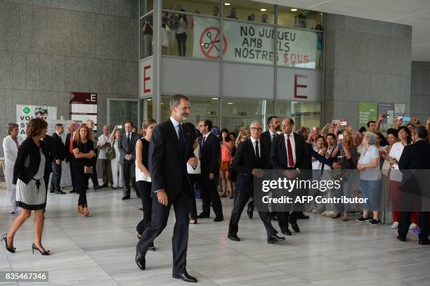 Spain's King Felipe VI and Queen Letizia leave the Sant Pau hospital in Barcelona after visiting victims of the Barcelona attack on August 19 two...