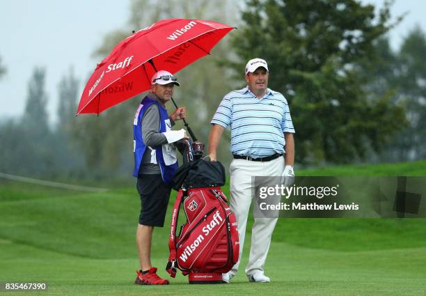 Anthony Wall of England speaks with his caddie on the 5th during day three of the Saltire Energy Paul Lawrie Matchplay at Golf Resort Bad Griesbach...